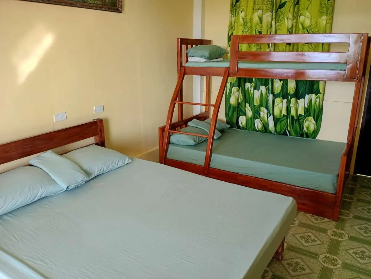 Double bed and bunk bed in the deluxe bungalow