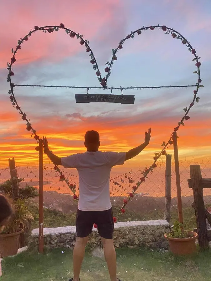 Guest in the heart frame at sunset